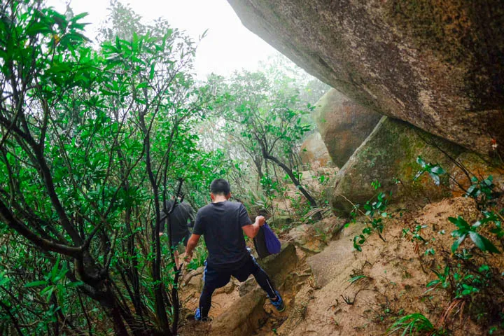 Path to Mount Nicholson surrounded by giant rocks.